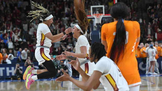 Kamilla Cardoso celebrates the game winning shot with guard Te-Hina Paopao against Tennessee.